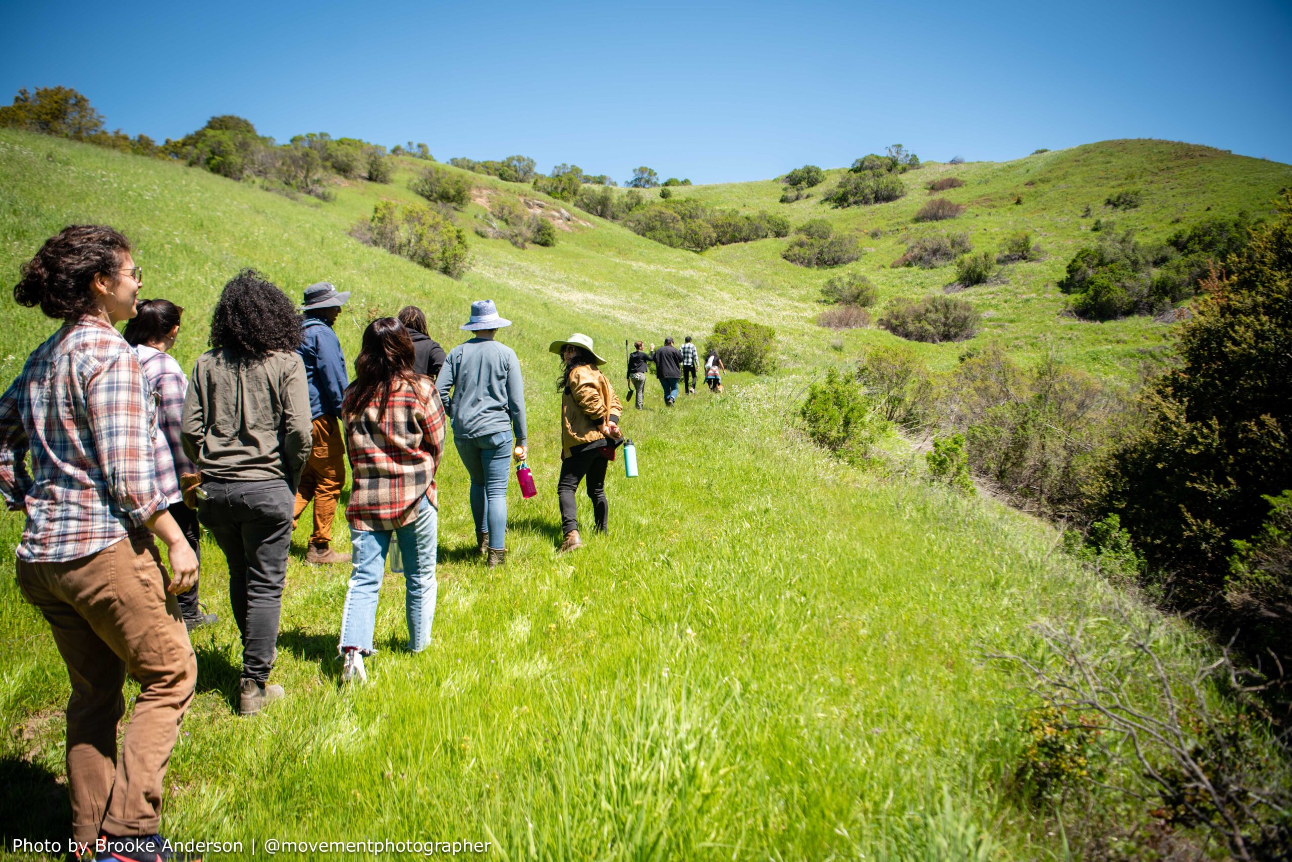 Photo of a group of people walking outdoors